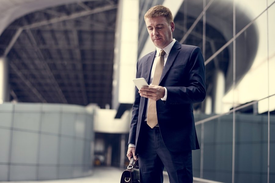 Businessman traveling with phone